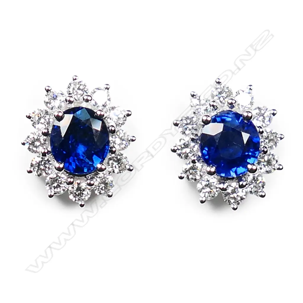 A pair of 18ct white gold sapphire and diamond stud earrings, Image 1++