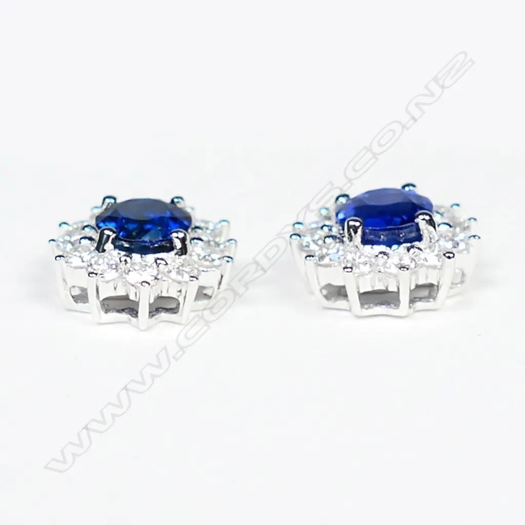 A pair of 18ct white gold sapphire and diamond stud earrings, Image 1++