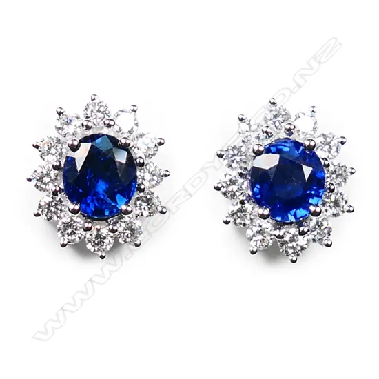 A pair of 18ct white gold sapphire and diamond stud earrings,
