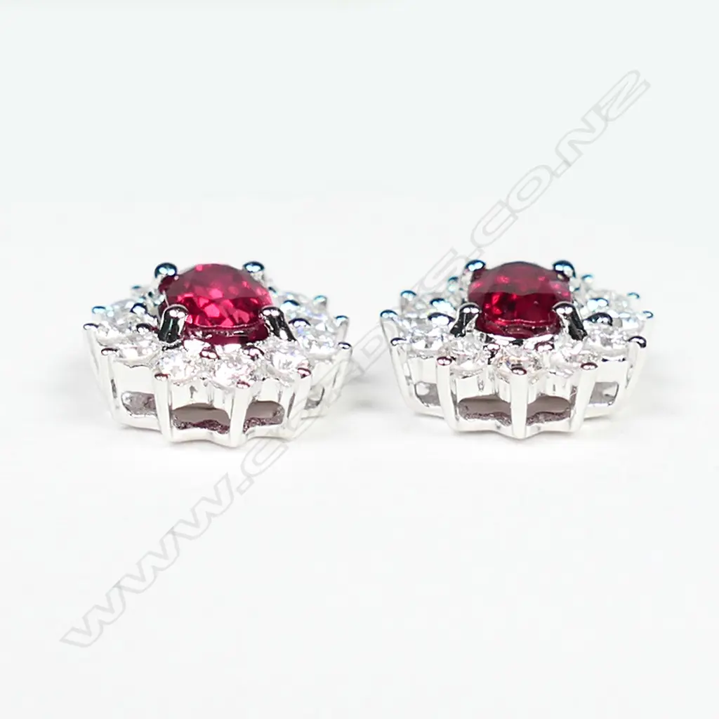 A pair of 18ct white gold, ruby and diamond stud earrings, Image 1++