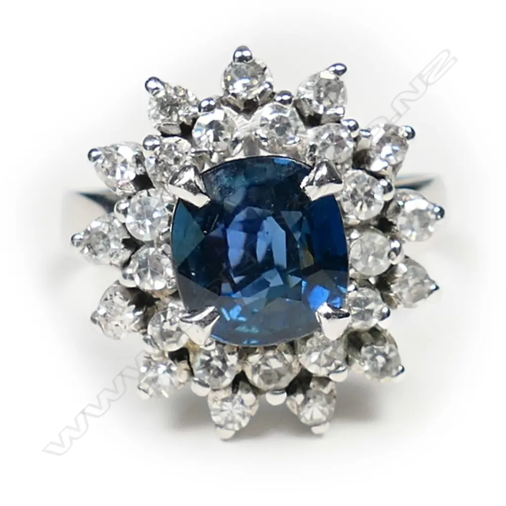 A 9ct white gold sapphire and diamond cluster ring, Image 1++