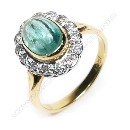 An estate 18ct gold, emerald and diamond ring,