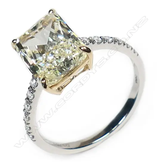 A 14ct white gold and fancy yellow diamond classic ring,