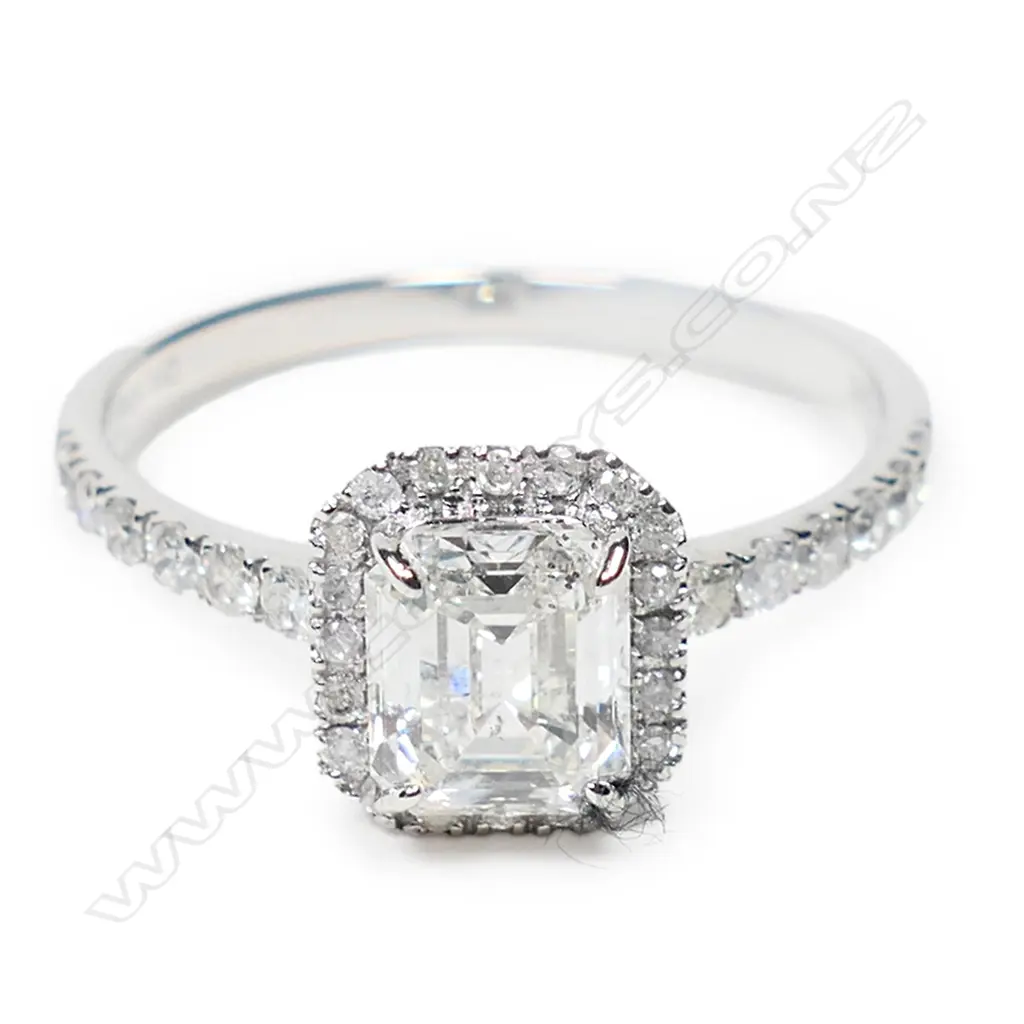 A 14ct white gold and diamond halo ring, Image 1++