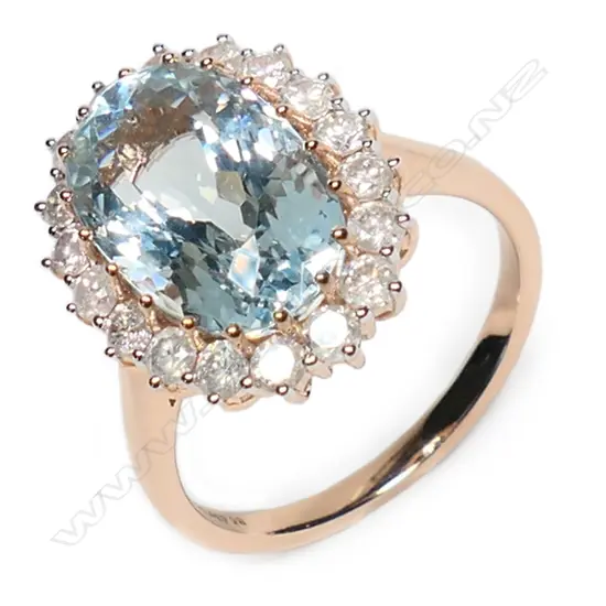 A 14ct rose gold, aquamarine and diamond vintage style halo ring,