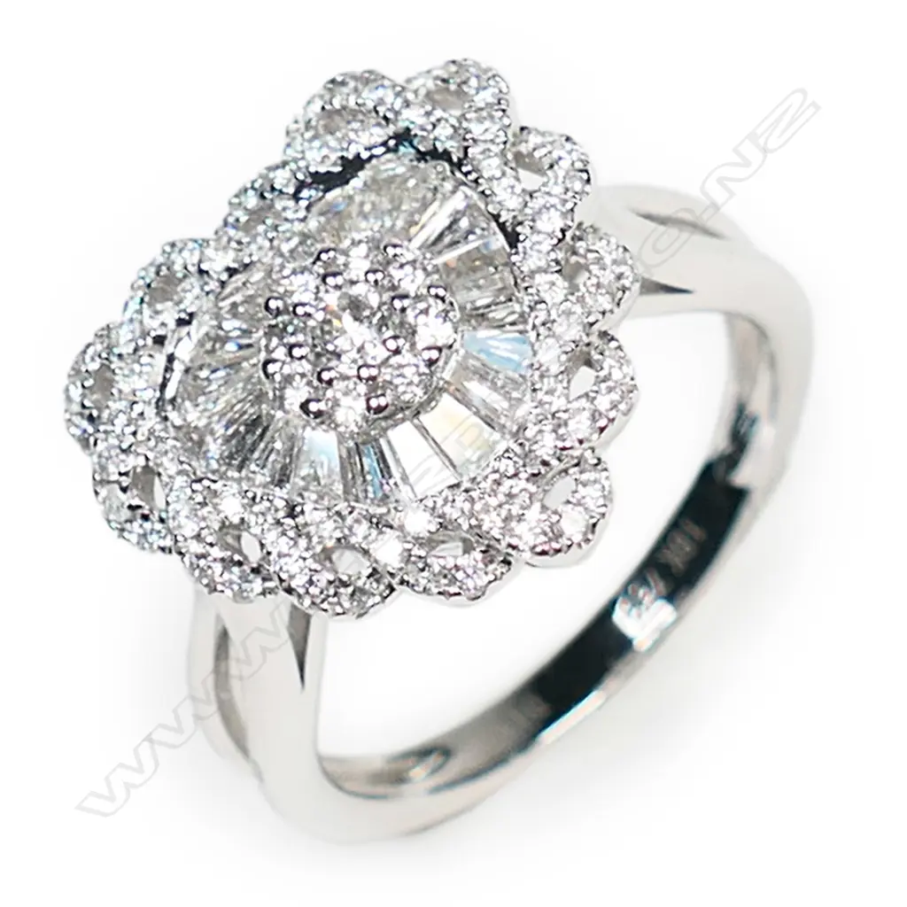 An 18ct white gold and diamond heart shaped ring, Image 1++