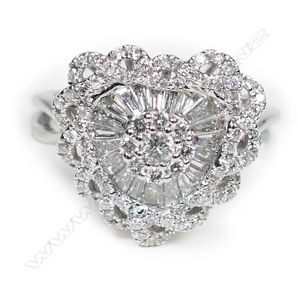 An 18ct white gold and diamond heart shaped ring, Image 1++