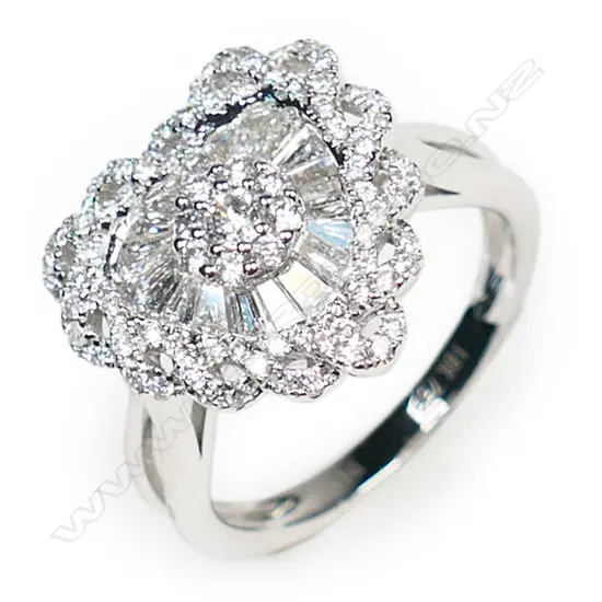 An 18ct white gold and diamond heart shaped ring,