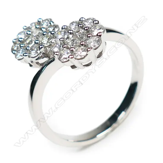 An 18ct white gold and diamond double cluster ring,