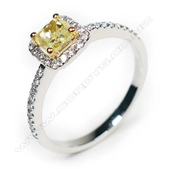 An 18ct white gold and yellow diamond ring,