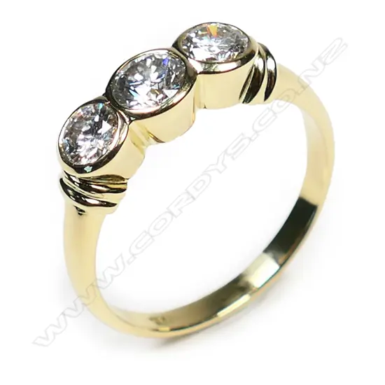 An 18ct yellow gold and three stone diamond ring,