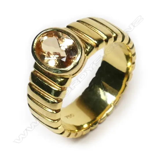 A heavy 18ct yellow gold and citrine ring,