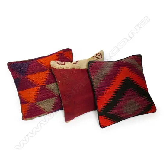 Three scatter cushions with various old kilim faces,