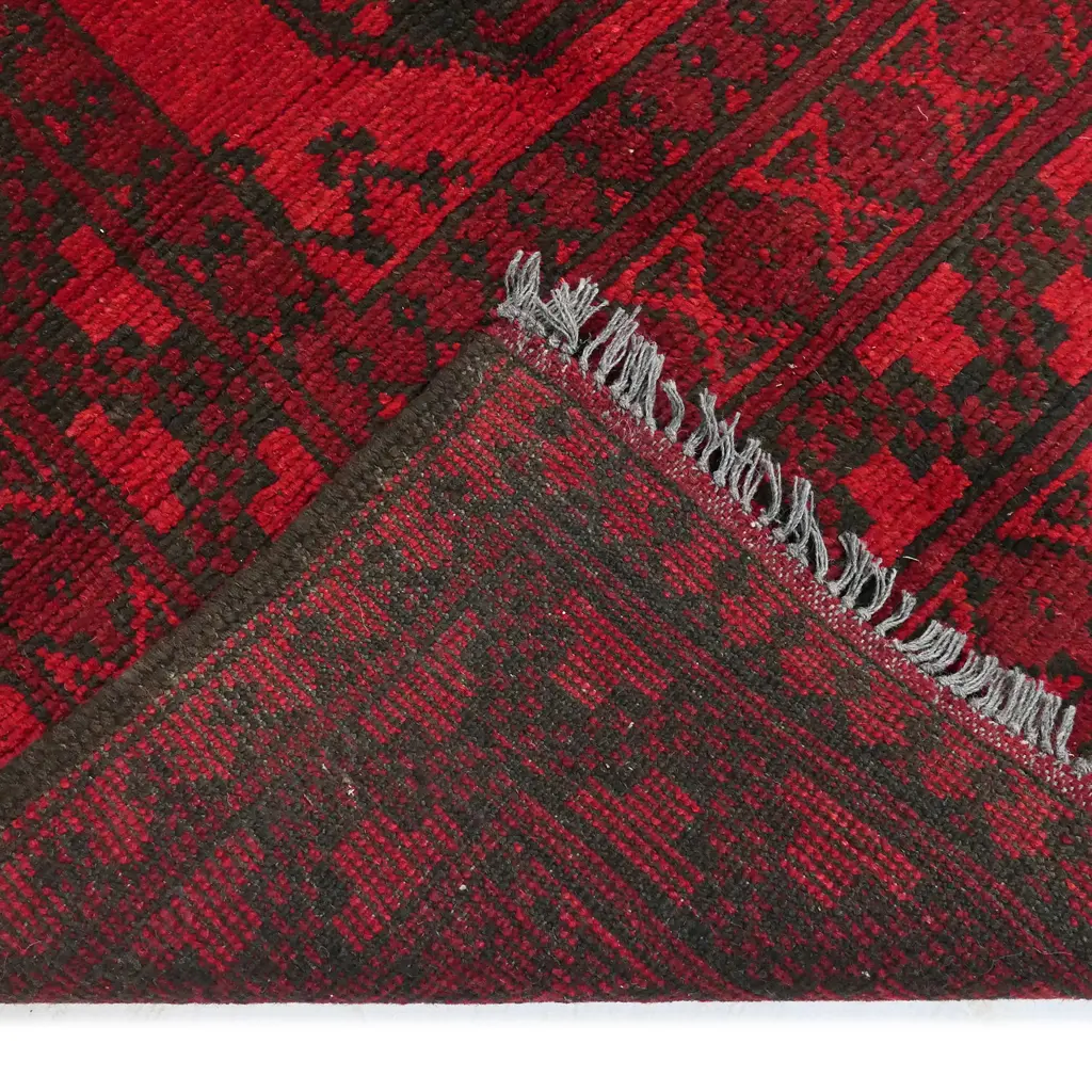 An Afghan hand knotted wool 'elephant foot' pattern carpet, Image 1++