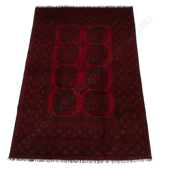 An Afghan hand knotted wool 'elephant foot' pattern carpet,