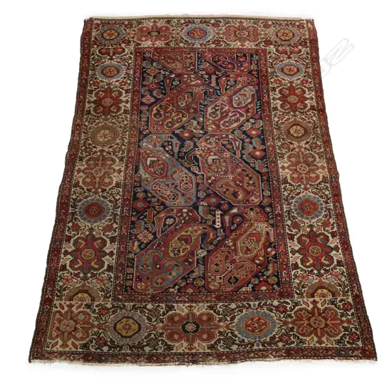 An antique hand knotted rug