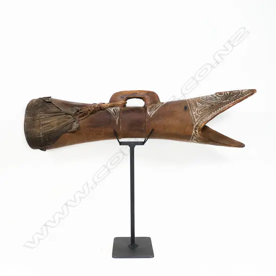 A PNG kundu drum, with carved surface decoration highlighted with white pigment,