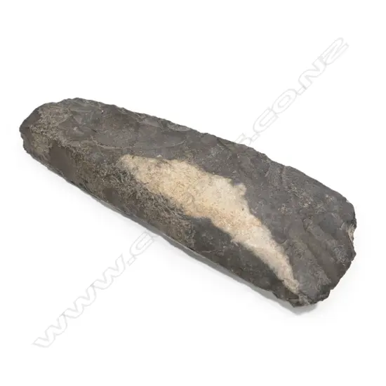 A large, unpolished flaked adze blade portion (toki). Y21577