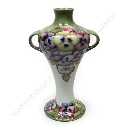 A William Moorcroft early Pansy pattern two handled vase,