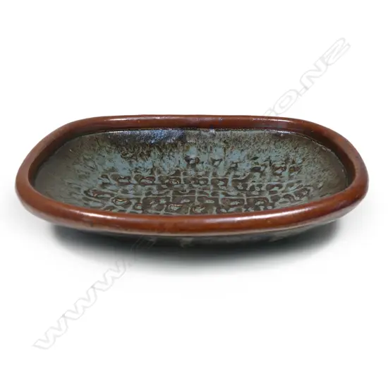 A vintage Len Castle platter of rounded rectangular form,