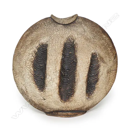 A Len Castle discoid stoneware vase, three heavily combed vertical rope impressions to each side, concave mouth, iron oxide washed matt glaze, impressed potter’s mark. H.355mm