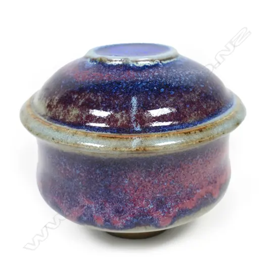 A Peter Stichbury red / blue glazed lidded pot,