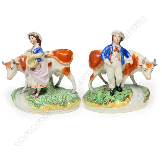 A pair of uncommon Victorian Staffordshire country figures,