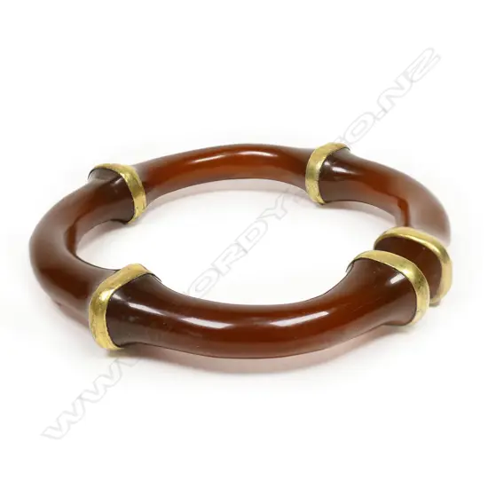 A good Chinese orange/brown agate bangle,
