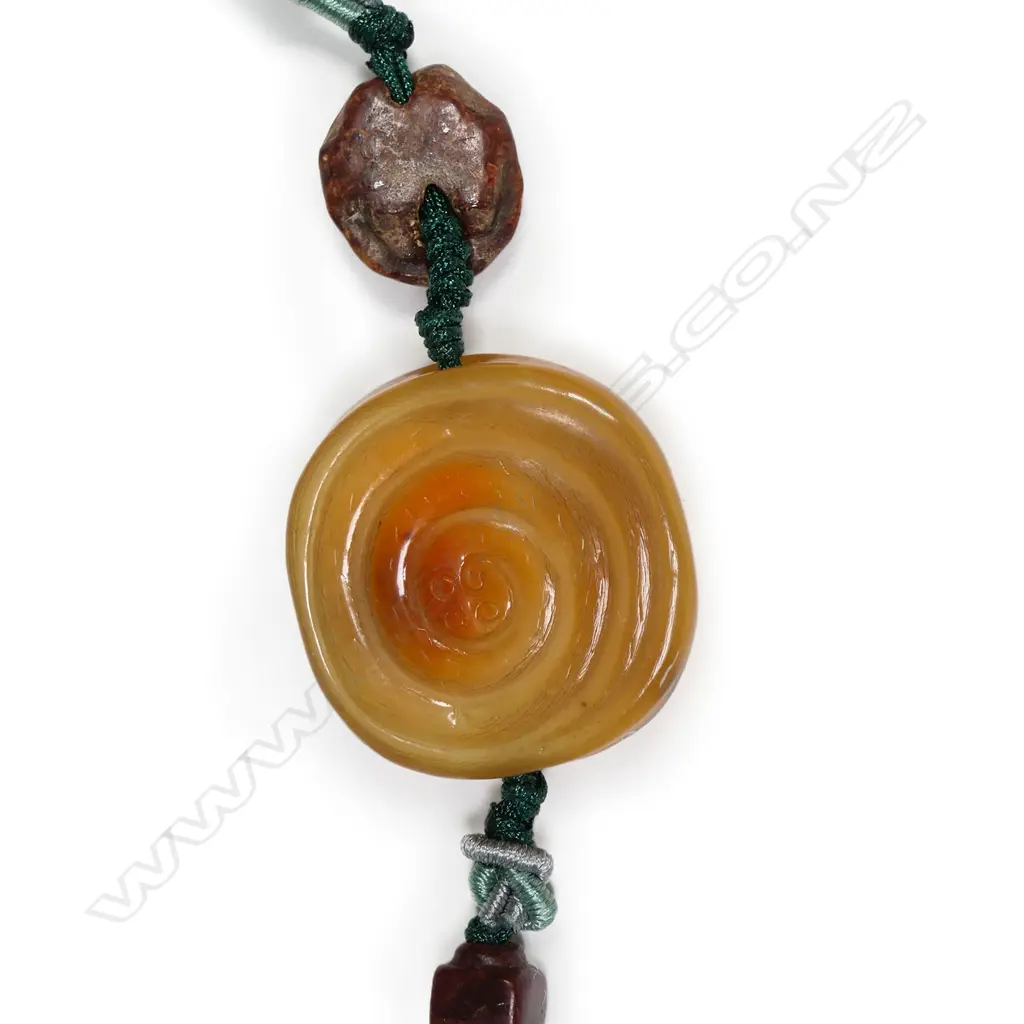 A Chinese Qing carved hornbill pendant with ancient jade beads Image 1++