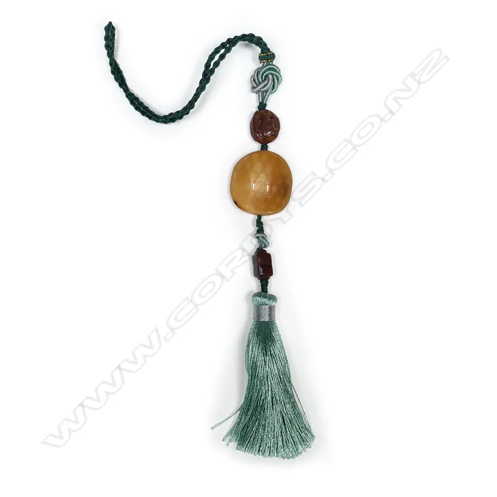 A Chinese Qing carved hornbill pendant with ancient jade beads Image 1++