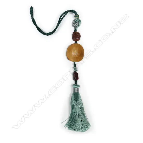 A Chinese Qing carved hornbill pendant with ancient jade beads