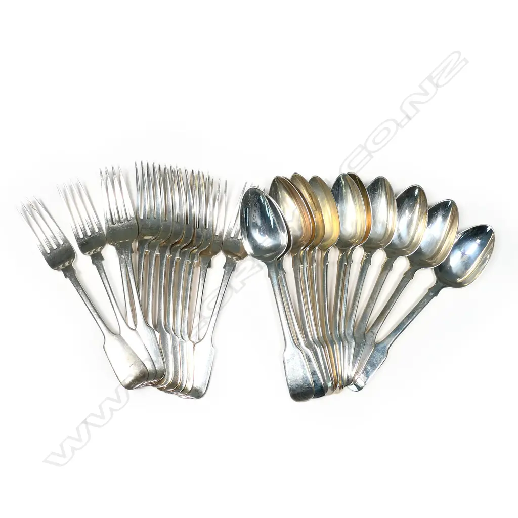 A 24 piece, twelve place setting of silver dessert forks and spoons. Forks Newcastle 1842/3, spoons London 1807. Total 1025gm Image 1++
