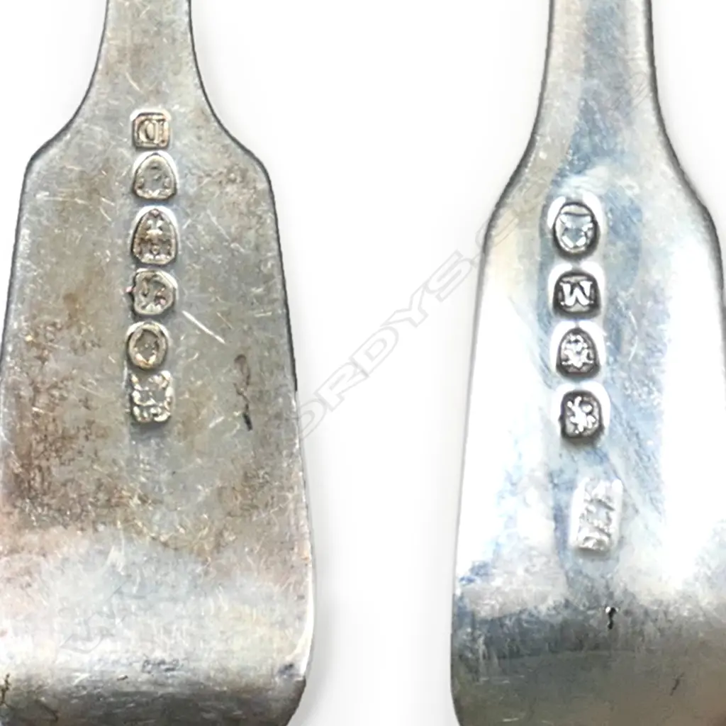 A 24 piece, twelve place setting of silver dessert forks and spoons. Forks Newcastle 1842/3, spoons London 1807. Total 1025gm Image 1++