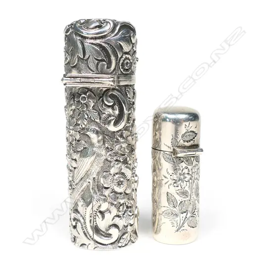 Two Victorian silver cased perfume bottles,