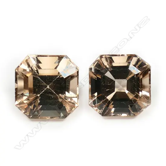 A pair of imperial topaz gemstones,
