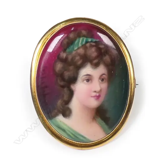 A 9ct framed Royal Doulton hand painted signed portrait miniature brooch,