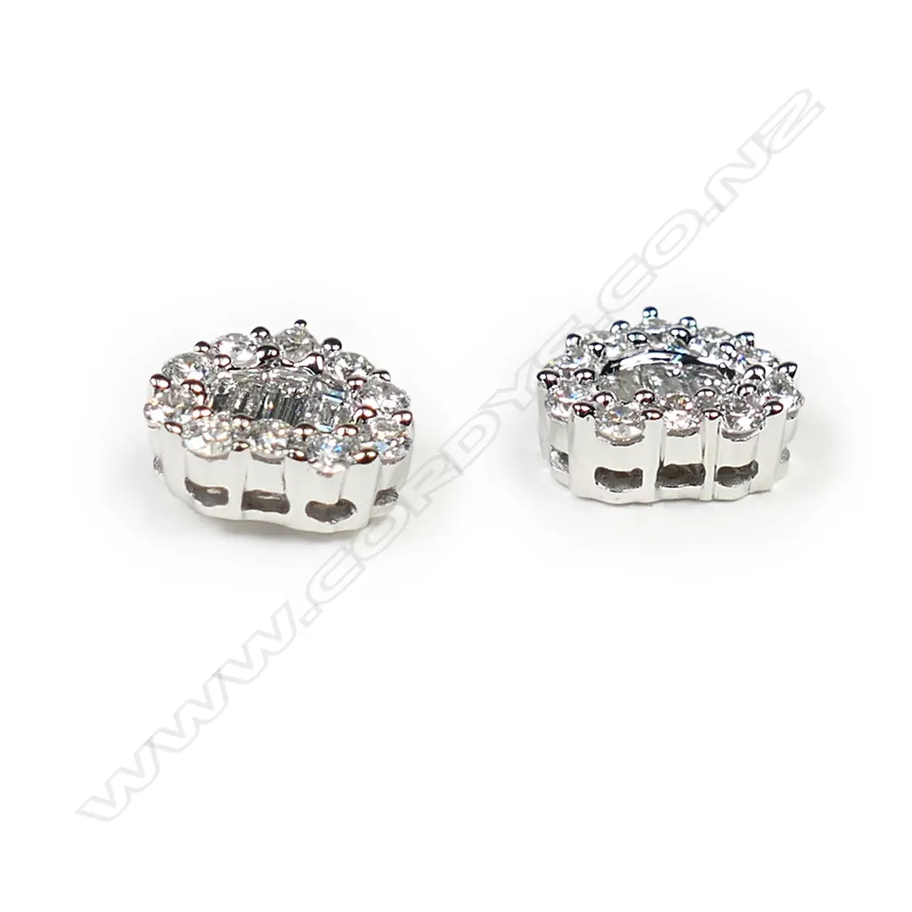 A pair of 18ct white gold and diamond cluster earrings, Image 1++
