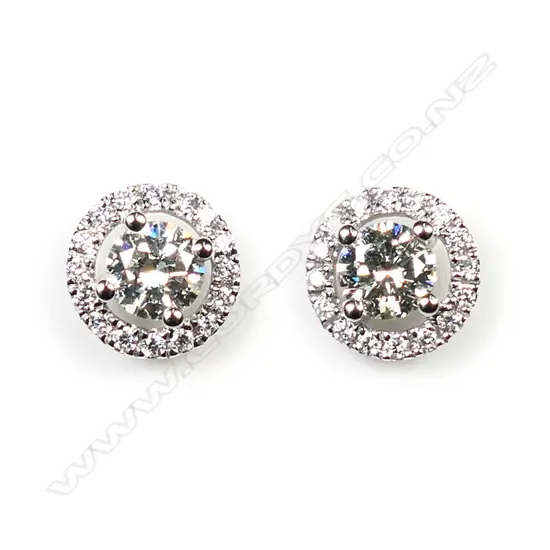 pair of 18ct white gold and diamond cluster earrings.