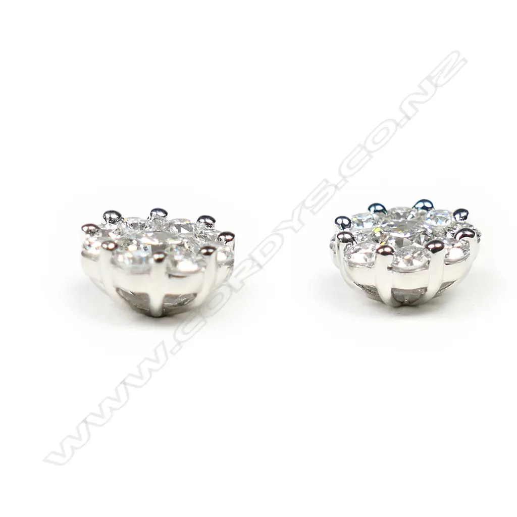 A pair of18ct white gold and diamond cluster earrings, Image 1++