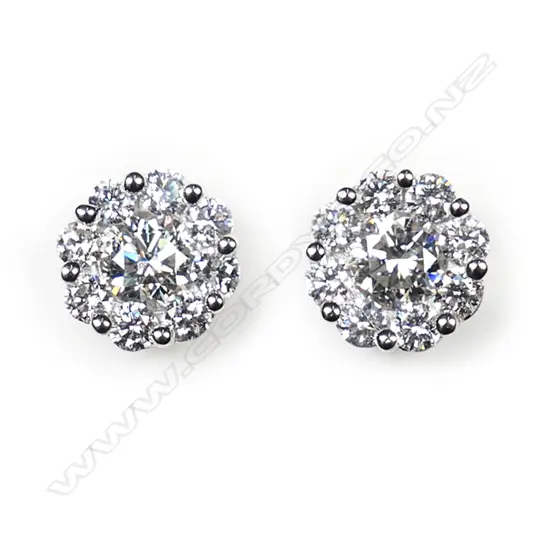 A pair of18ct white gold and diamond cluster earrings,