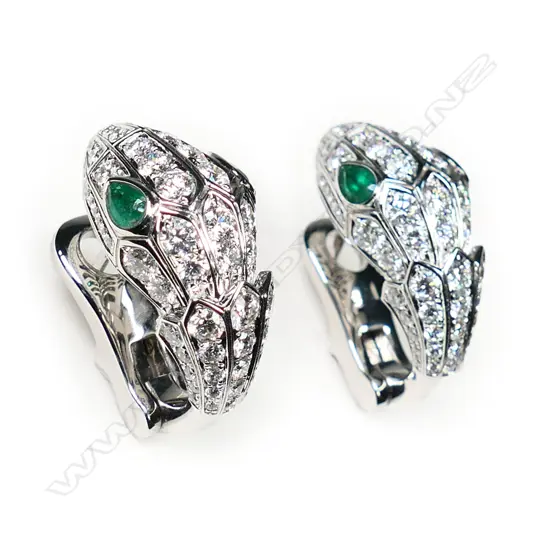 A pair of impressive 18ct white gold, diamond and emerald lizard head designer earrings,