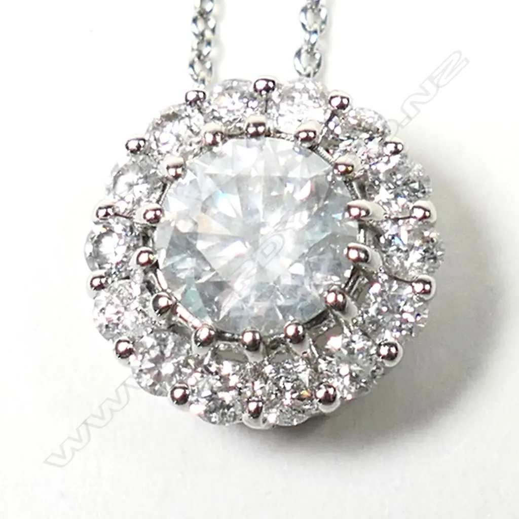 A 14ct white gold and diamond halo pendant necklace, Image 1++