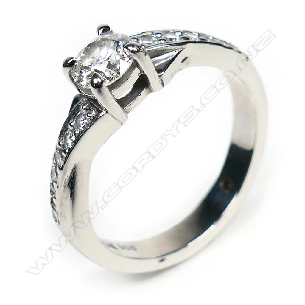 A modern platinum and diamond solitaire ring, Image 1++