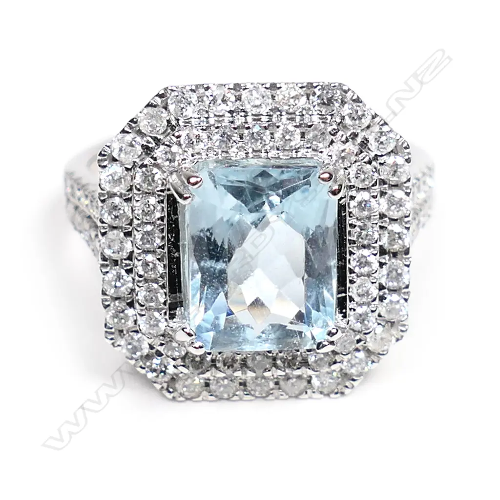 A 14ct white gold, aquamarine and diamond double halo ring, Image 1++