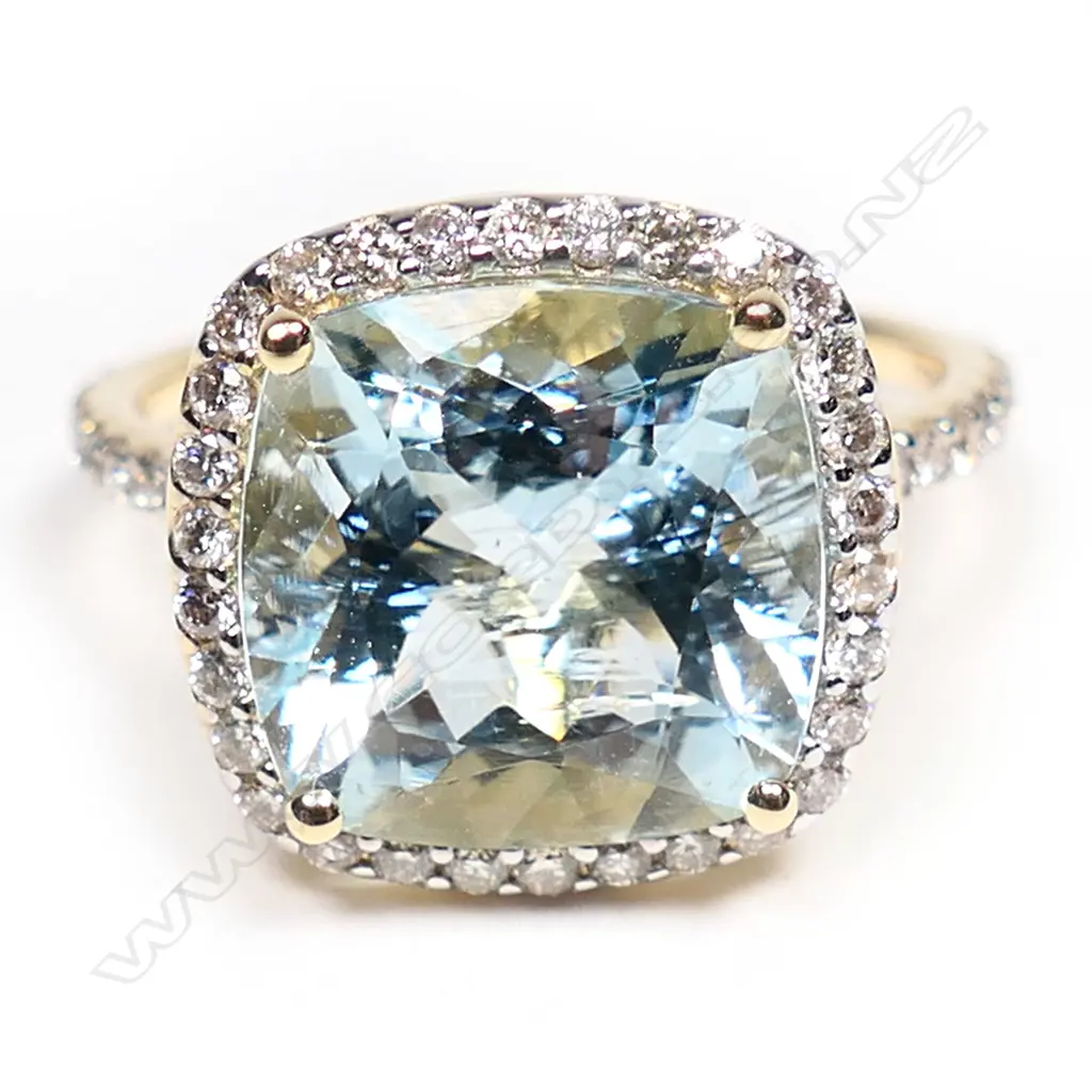 A 14ct gold, aquamarine and diamond halo ring, Image 1++