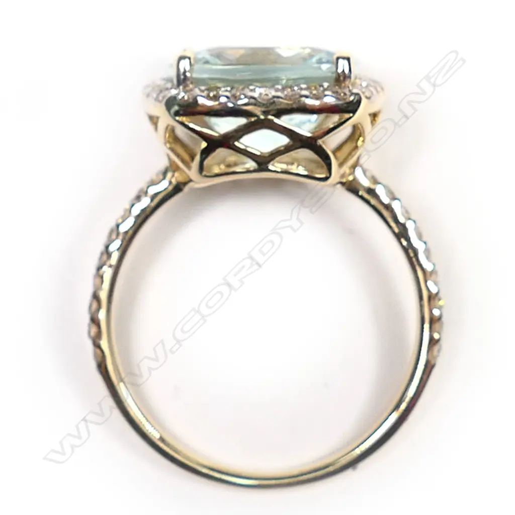 A 14ct gold, aquamarine and diamond halo ring, Image 1++