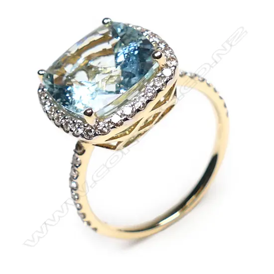 A 14ct gold, aquamarine and diamond halo ring,