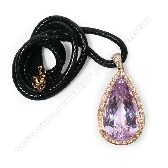 An 18ct rose gold and diamond framed large kunzite pendant,