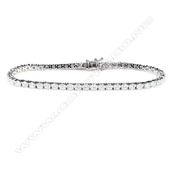 An 18ct white gold and diamond tennis bracelet,