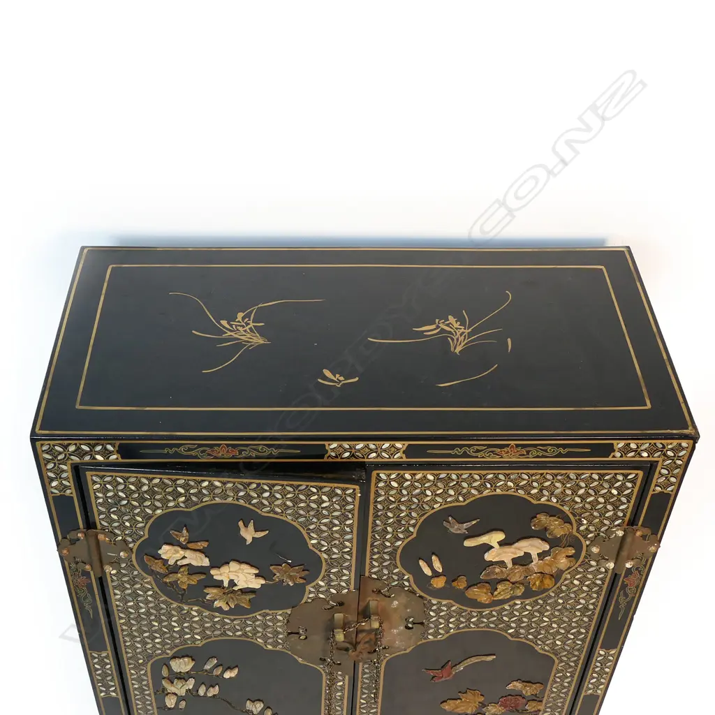 A vintage oriental black lacquer small cupboard with carved coloured stone decoration, Image 1++